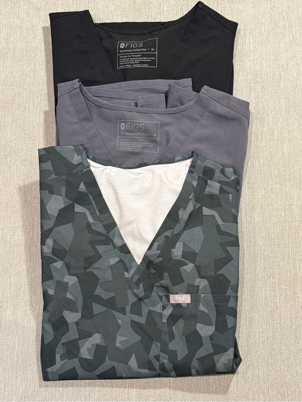 FIGS Women’s Short Sleeve Scrub Tops - Black, Gray & Green Camouflage